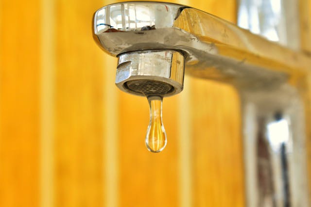 Close up image of a leaky tap