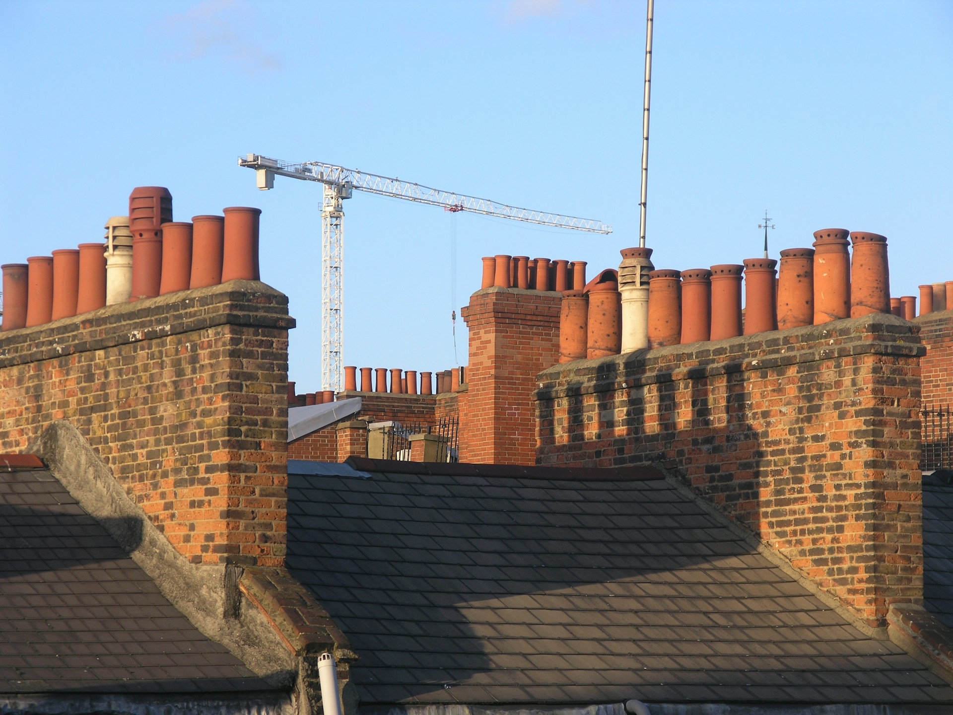 Close-up view of UK roof tiles showing traditional clay roofing materials and weathered texture