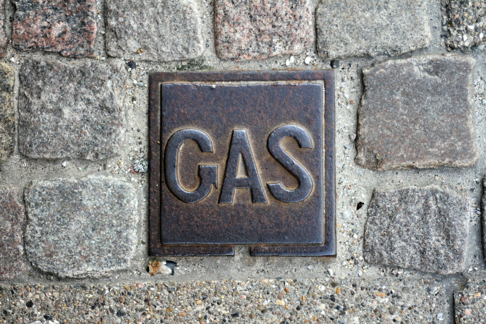 Gas Safe registered engineer showing official ID card with license number to homeowner
