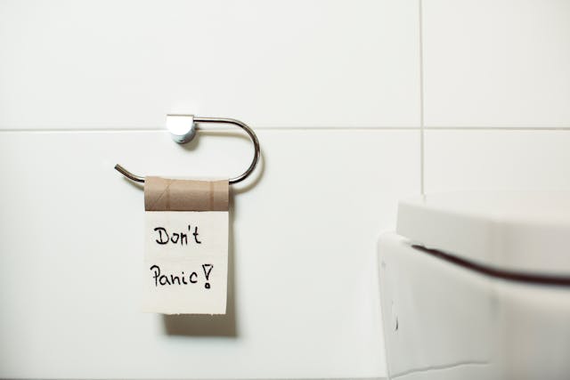 Image of an toilet with the message don't panic